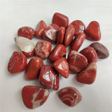 Collection of red marbled stones on a white background
