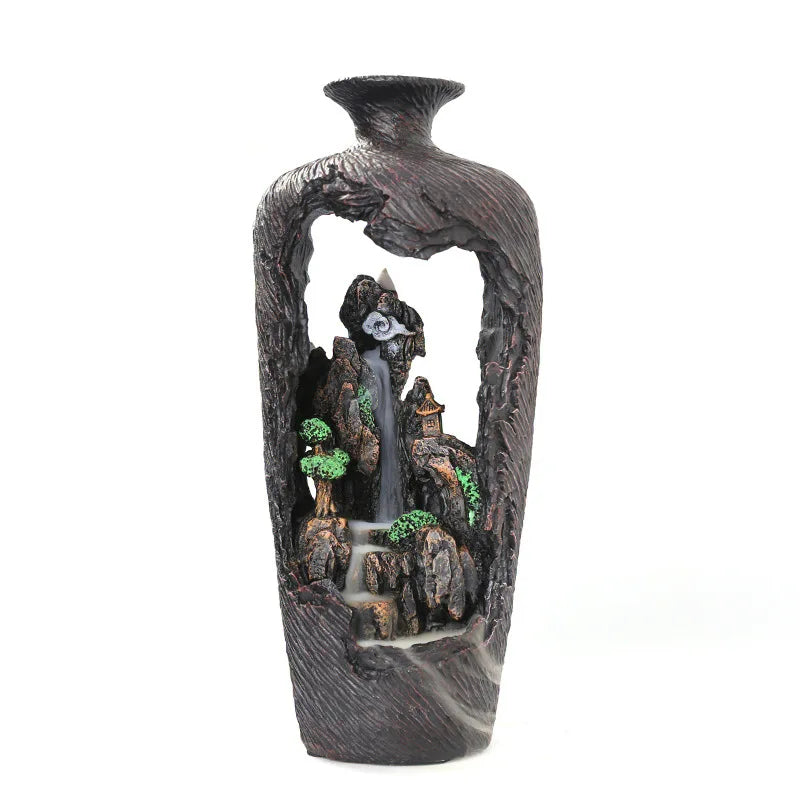 Decorative vase with a mountain and waterfall design on a white background