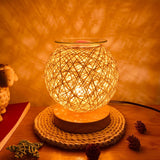 Woven lamp on a wooden surface with a warm glow
