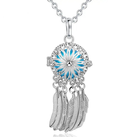 Silver dreamcatcher necklace with blue center and feathers, brand 'Eudora' visible.