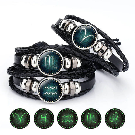 Set of zodiac symbol bracelets with glowing icons on a white background