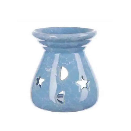 Blue ceramic oil burner with star and moon cutouts on a white background