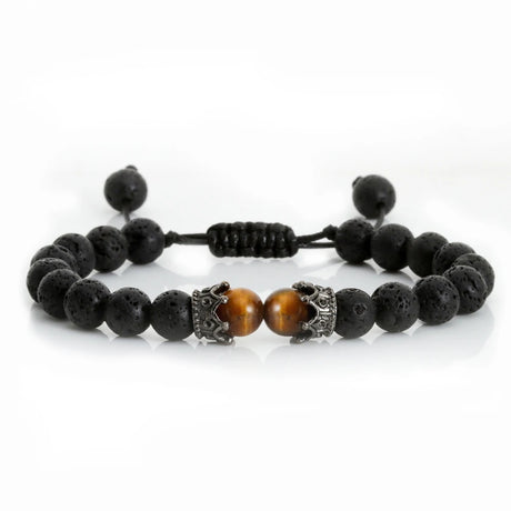 Black beaded bracelet with a central brown bead on a white background