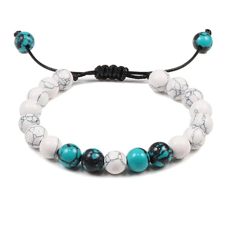 Bracelet with white and turquoise beads on a white background