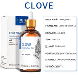 Clove essential oil bottle with dropper and packaging on a white background