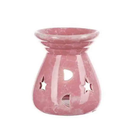 Pink marble-patterned oil burner with star and moon cutouts on a white background