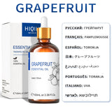 Grapefruit essential oil bottle with dropper and packaging on a white background