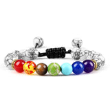 Colorful beaded bracelet with black marbleized ends on a white background