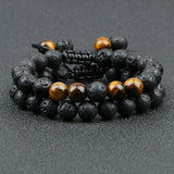 Black and brown beaded bracelets on a dark surface