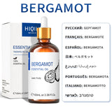 Bergamot essential oil bottle with dropper and packaging on a white background