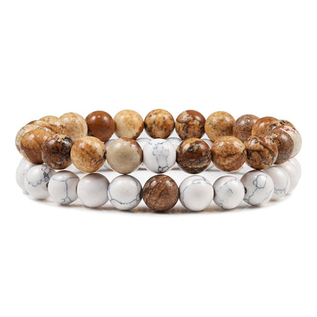 Set of three beaded bracelets with brown, beige, and white stones on a white background