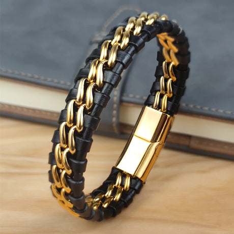 Black and gold chain bracelet on a wooden surface with a blurred background