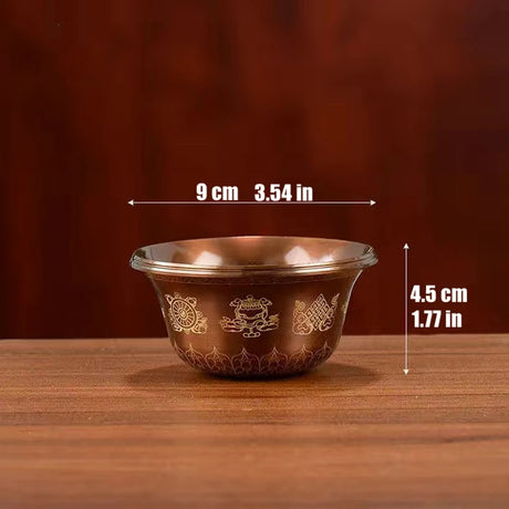 Brown ceramic bowl with gold patterns on a wooden surface, shown with measurements.