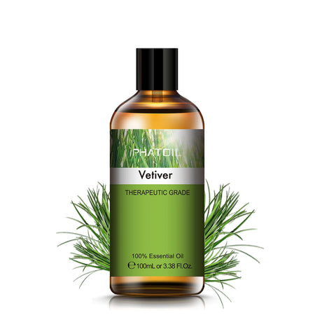 Bottle of PhatOil Vetiver essential oil with green leaves on a white background