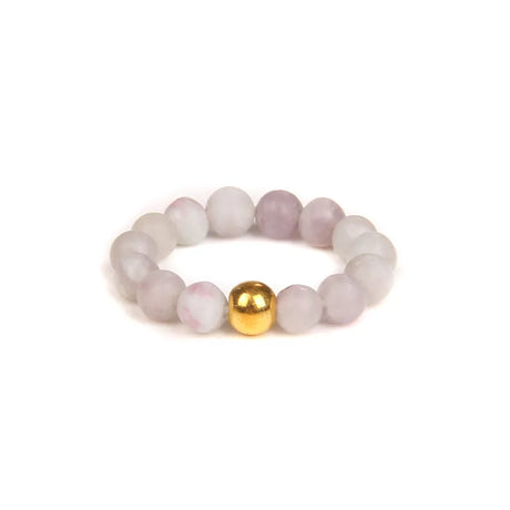 Beaded bracelet with a gold bead on a white background
