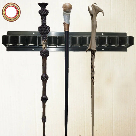 Wand holder with three decorative wands on a white background