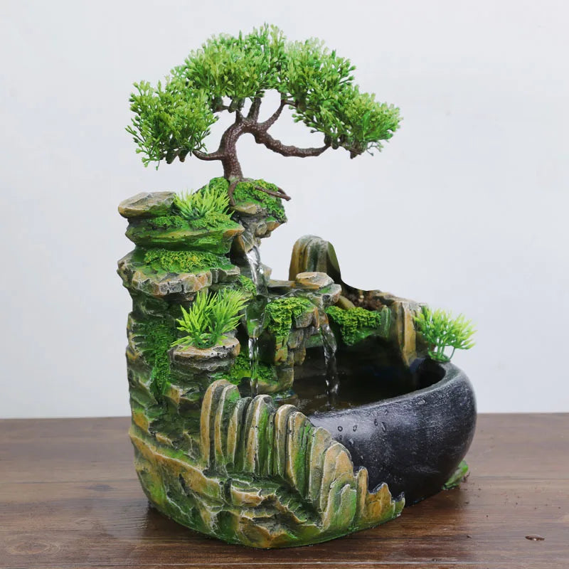 Decorative miniature landscape with a bonsai tree on a wooden surface