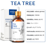 Tea tree essential oil bottle with dropper and packaging on a white background