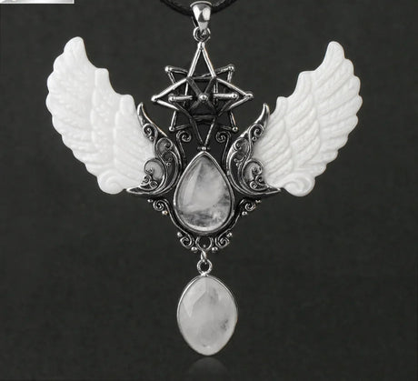 Pendant with wings and star design on a dark background