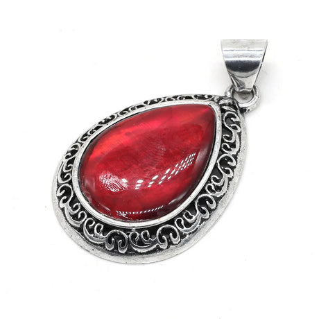 Red teardrop pendant with silver decorative frame on a white background