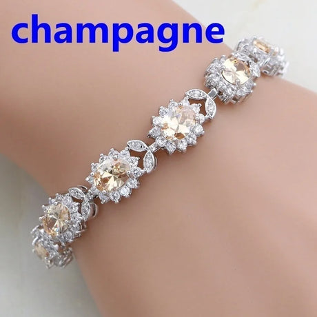 Bracelet with champagne-colored stones on a mannequin wrist, labeled 'champagne'.