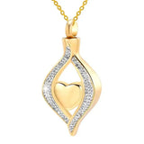 Gold pendant with heart design and diamond accents on a white background