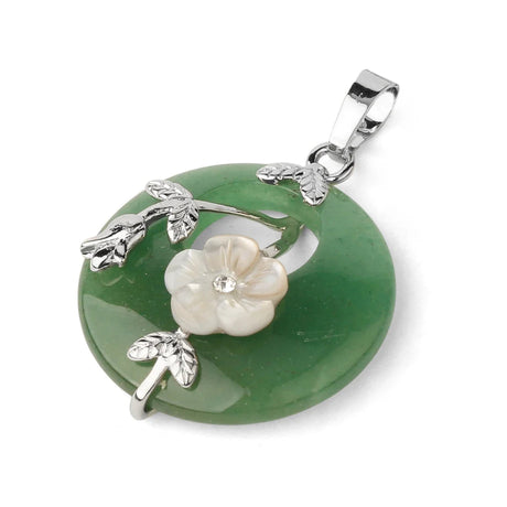 Green pendant with floral design on a white background