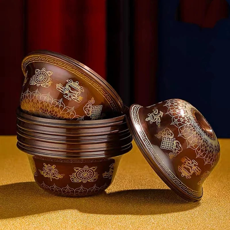 Decorative wooden containers with intricate carvings on a yellow surface