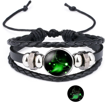 Black braided leather bracelet with a green glowing stone on a white background