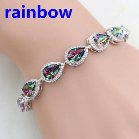 Multicolored teardrop-shaped gemstone bracelet on a wrist with 'rainbow' text above.