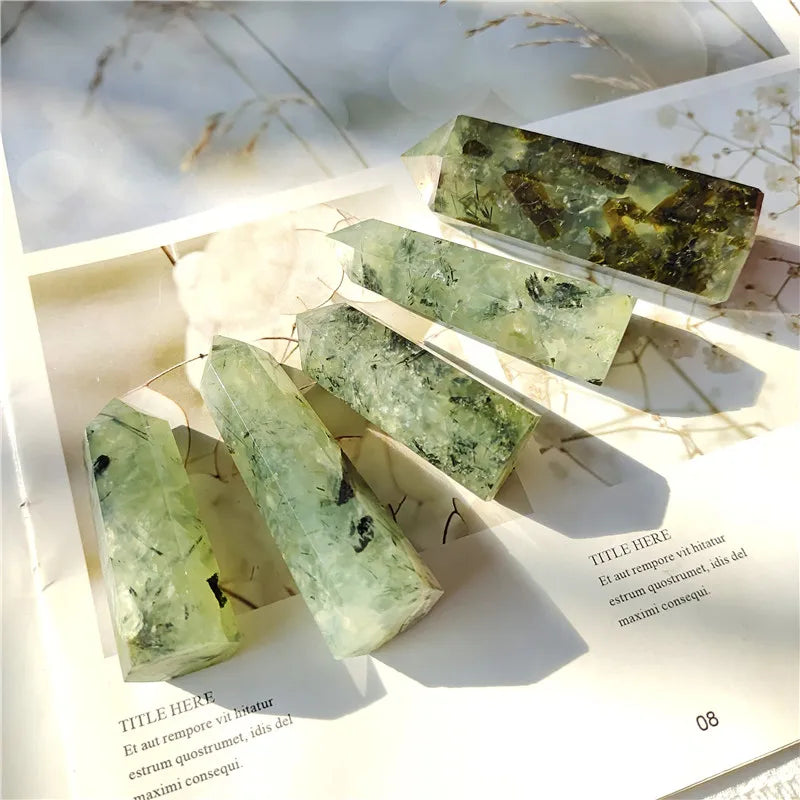 Green crystal-like objects on a textured surface with blurred background