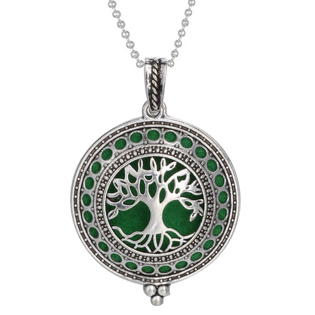 Silver pendant with green tree design on a white background