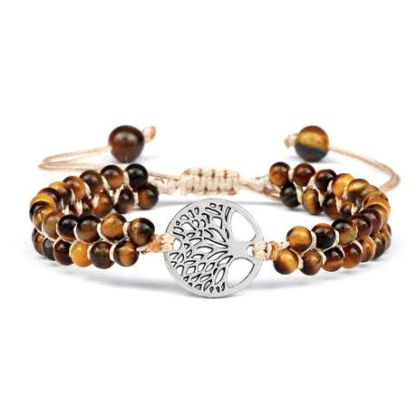 Set of tiger eye beaded bracelets with a silver tree of life charm on a white background