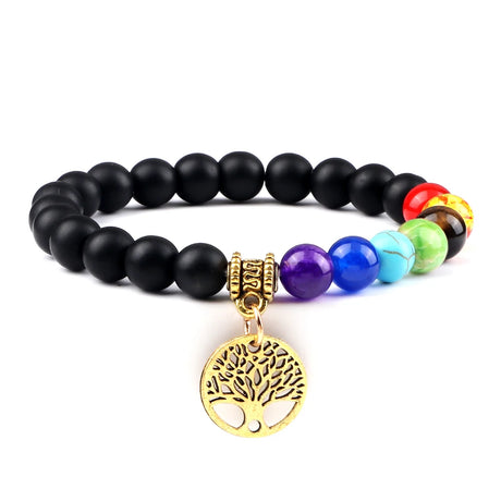 Black beaded bracelet with colorful beads and a gold tree of life charm on a white background