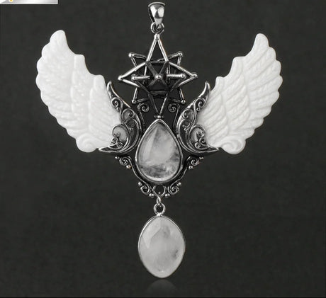 Pendant with wings and star design on a dark background