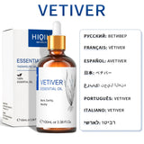 Vetiver essential oil bottle with dropper and packaging on a white background