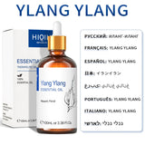 Ylang Ylang essential oil bottle with dropper and packaging on a white background
