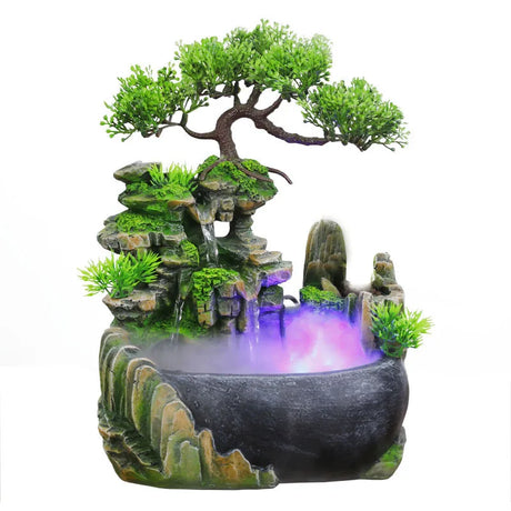 Decorative water fountain with bonsai tree and rockery on a white background