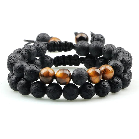 Set of three beaded bracelets with black and brown beads on a white background