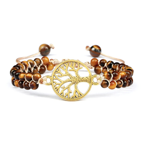 Bracelet with brown beaded strands and a gold tree of life charm on a white background