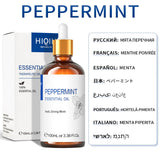 Peppermint essential oil bottle with dropper and packaging on a white background