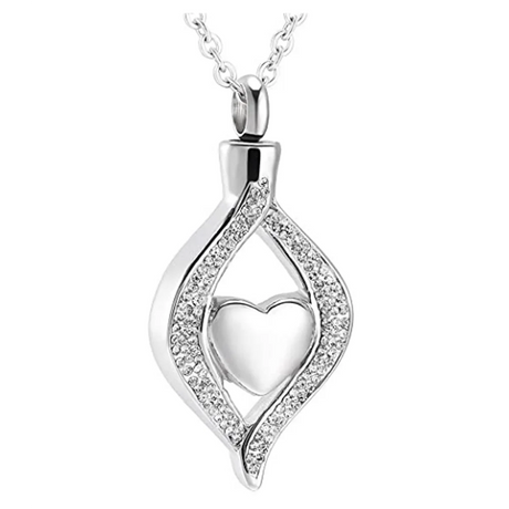 Silver pendant with heart design on a white background