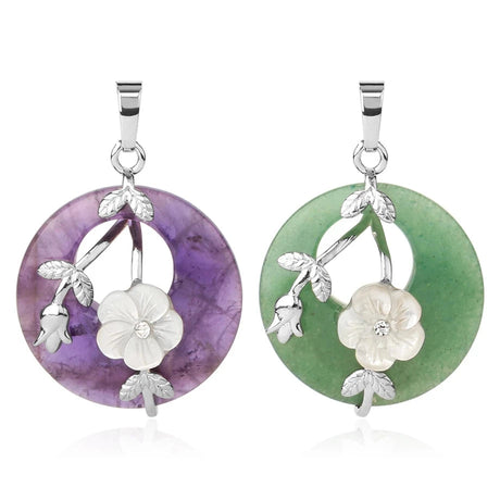 Two circular pendants with floral designs on a white background