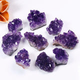 Amethyst crystal clusters on a white background