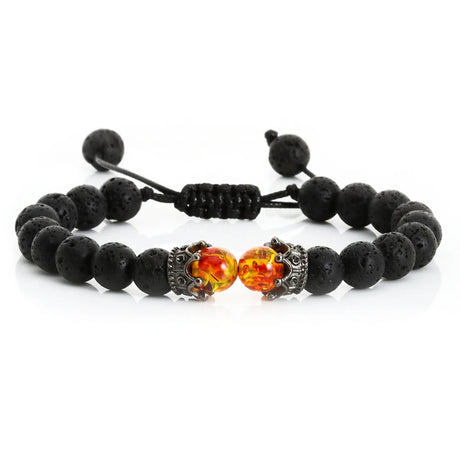 Black beaded bracelet with orange and silver beads on a white background