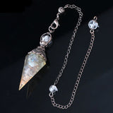 Crystal pendant with chain on a dark background, featuring the Cilia Jewelry logo.