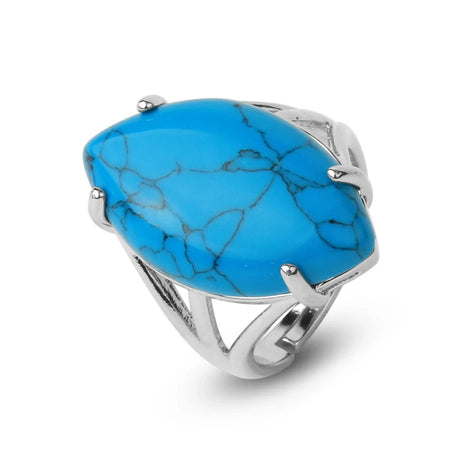 Turquoise ring with silver band on a white background