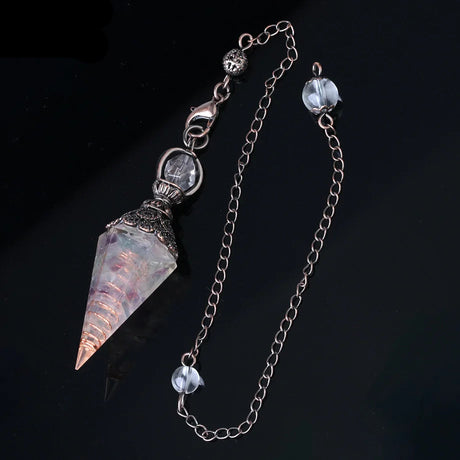 Crystal pendant necklace with chain on a dark background