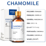 Chamomile essential oil bottle with dropper and packaging on a white background