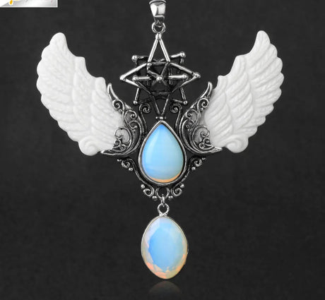 Pendant with wings and blue teardrop design on a dark background